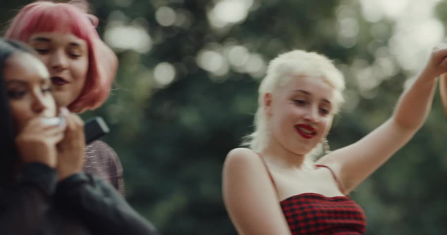 A group of female friends are outdoors spending time together