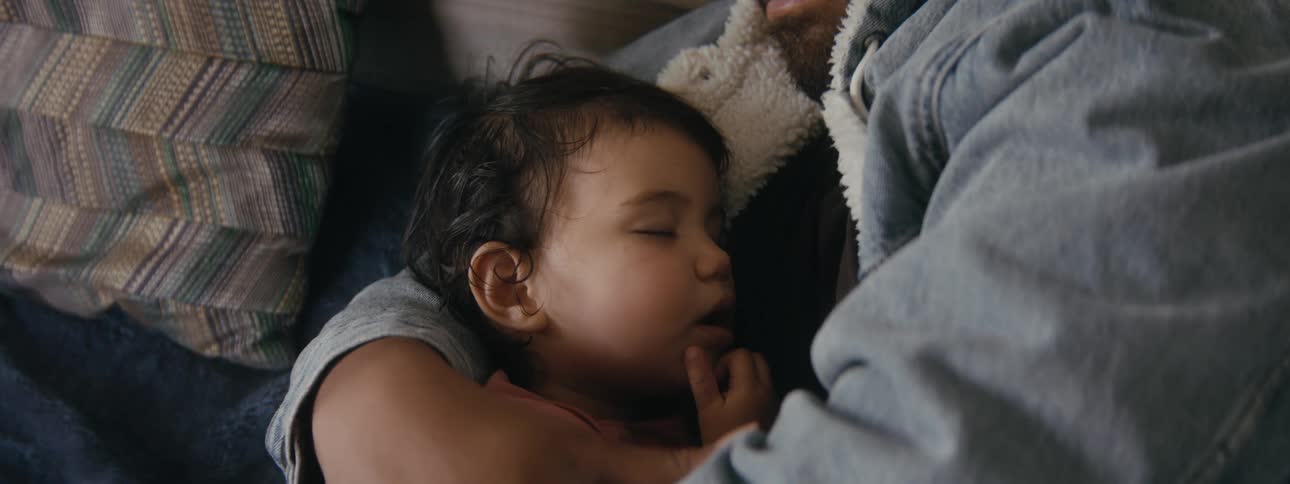 A father and daughter are sleeping