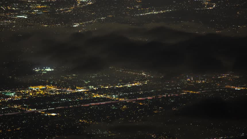 The traffic flows through the city at night