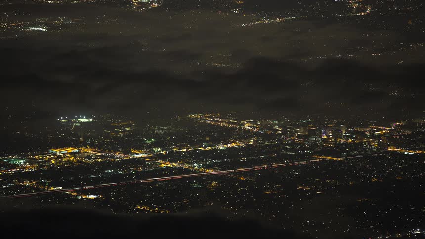 A city is alive with traffic after dark