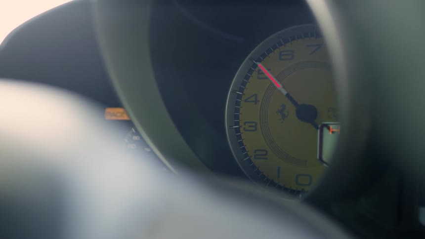 A speedometer of a car moves up and down