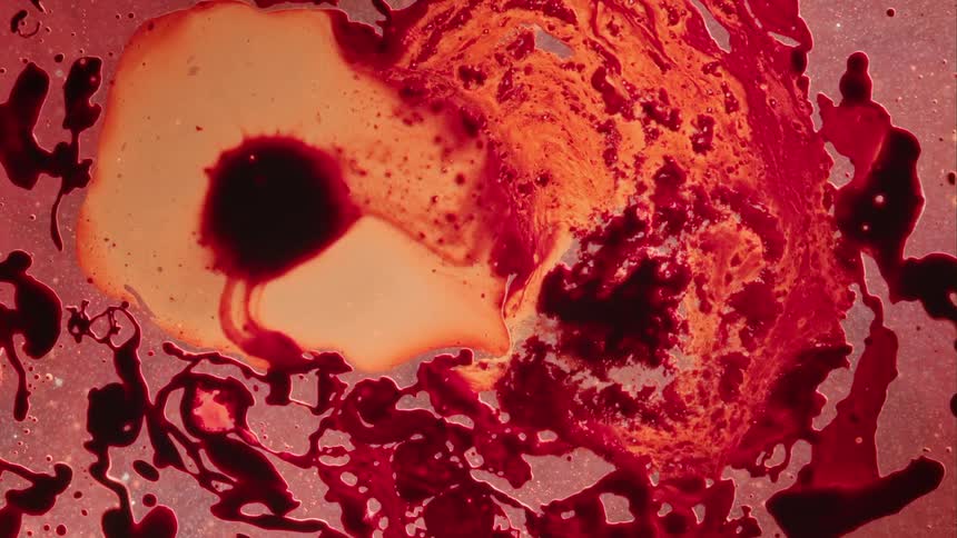 Flowing abstract red and orange liquid