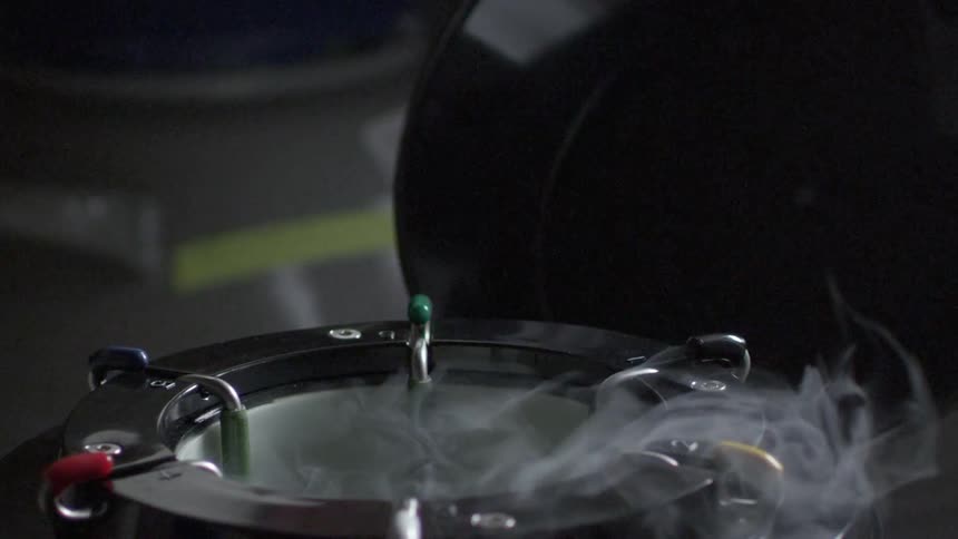 A cylinder has steam rising from it