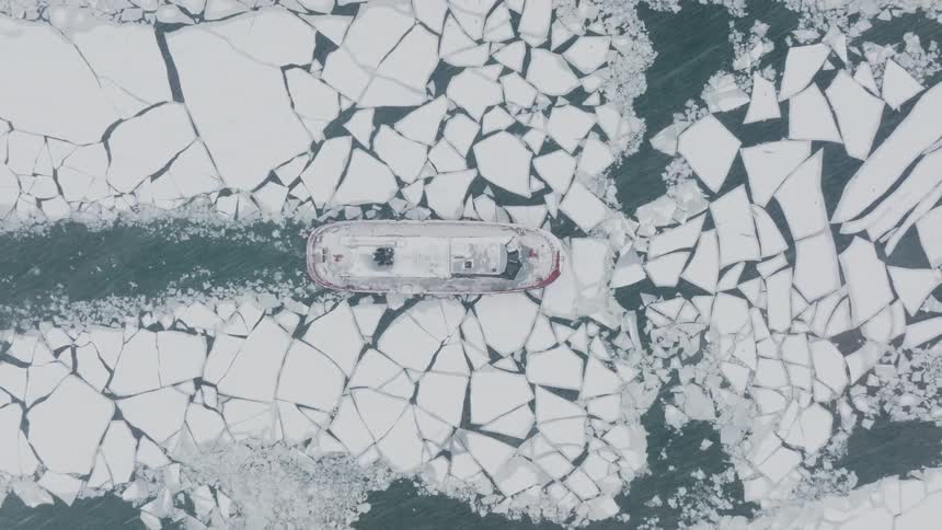 Icebreaker boat travels down the Chicago River