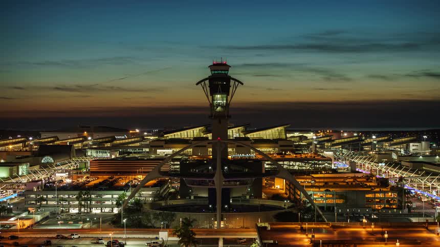 Night falls and afterglow fades to black air traffic control tower at LAX airport
