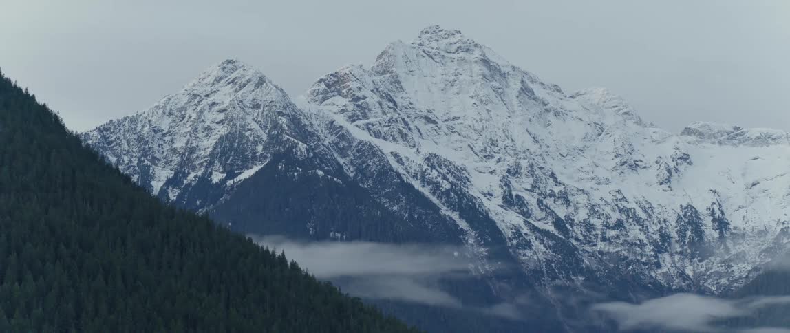 Snow capped jagged mountain peaks