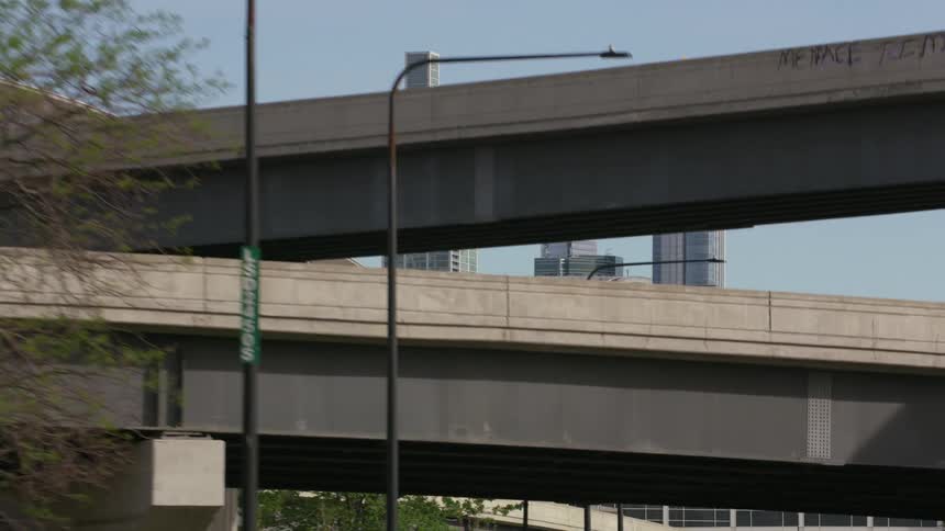 A bridge crosses over another bridge near downtown