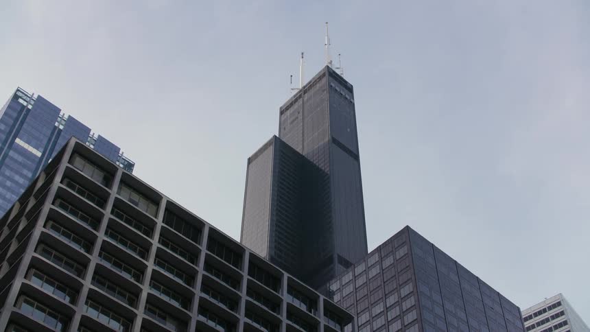 A view of Willis Tower and surrounding buildings from below