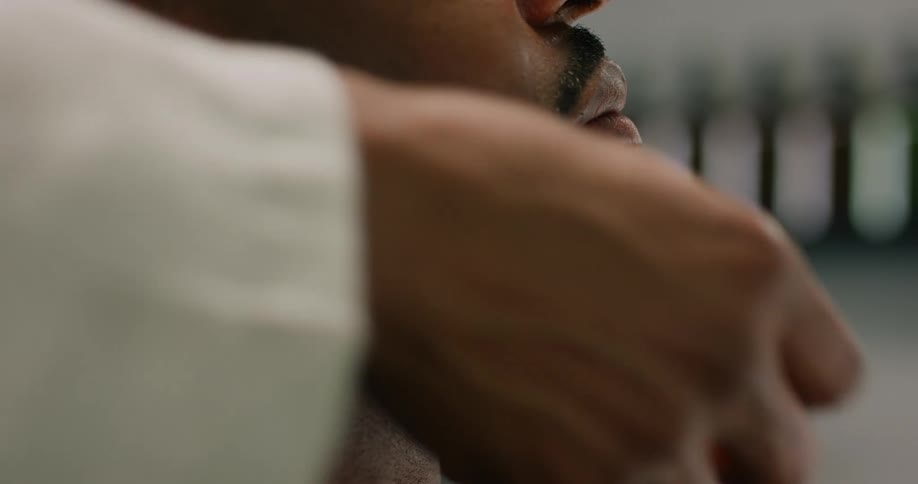 A barber massages a clients beard