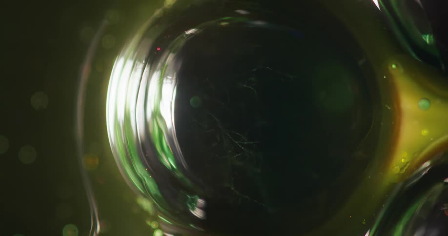 Bubbles are trapped inside a green glassy object