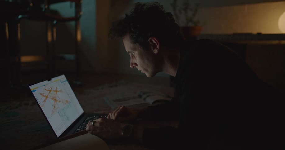 A man is typing on the laptop