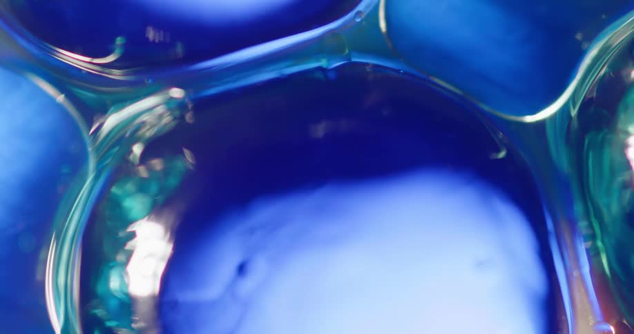 Blue bubble cells glowing and reflecting light