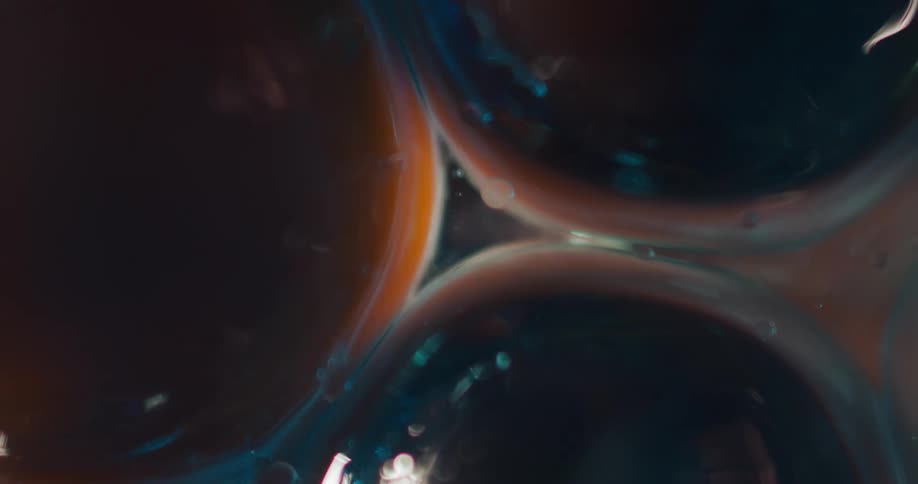 Close up of abstract liquid circles moving around