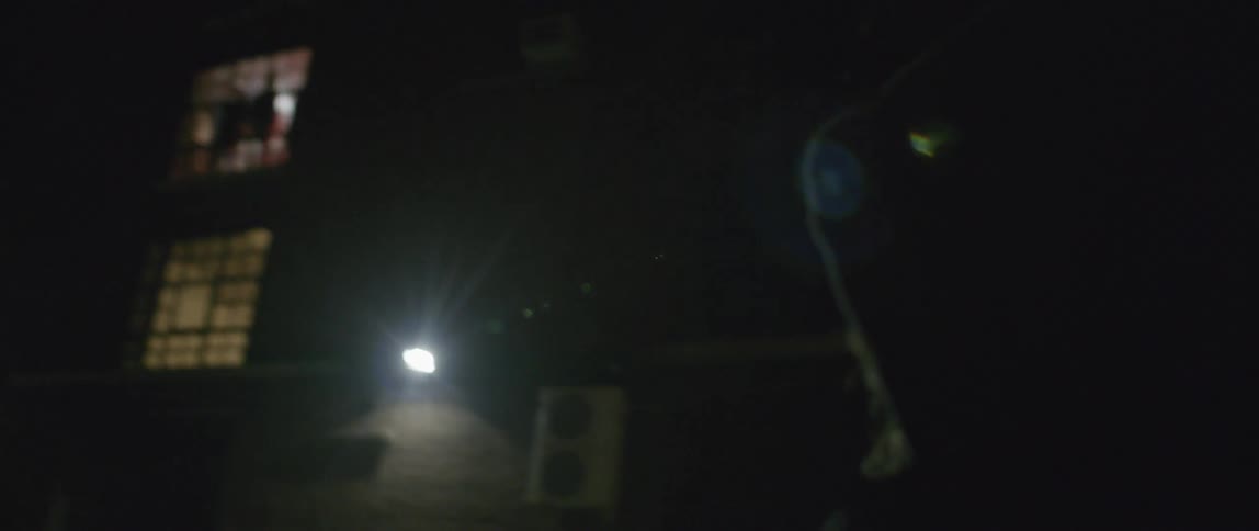 A person is filming something with a camera