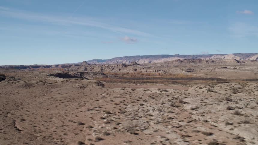 A desert landscape has peaks and valleys
