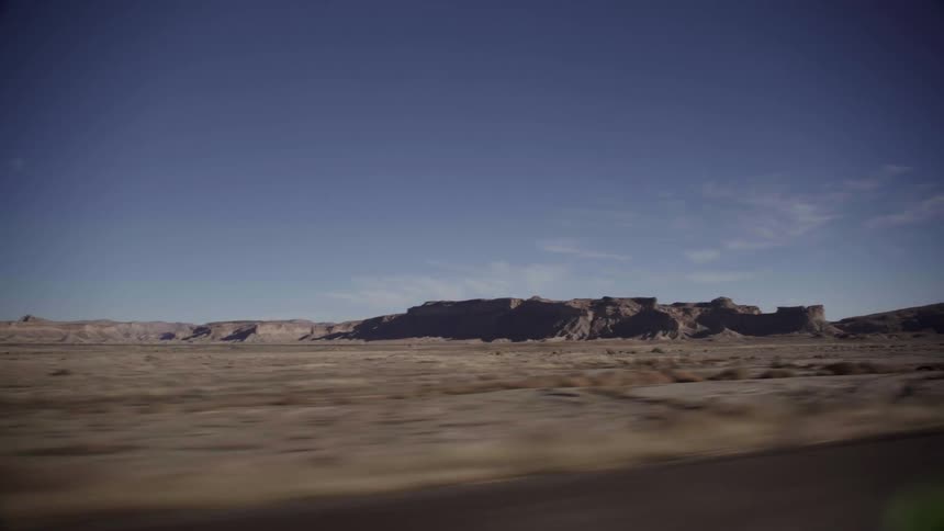 A mountain is past the desert