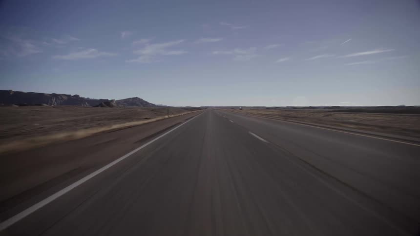 A road through a countryside during the day