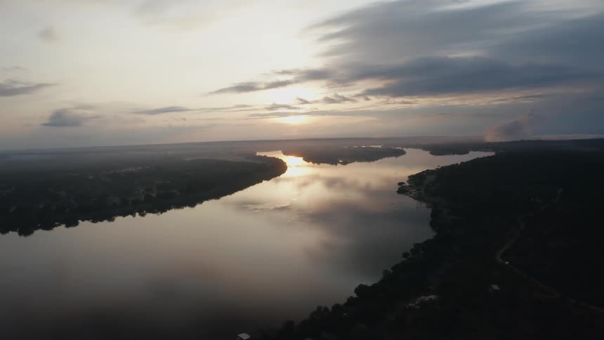Aerial view of clouds reflected in peaceful river