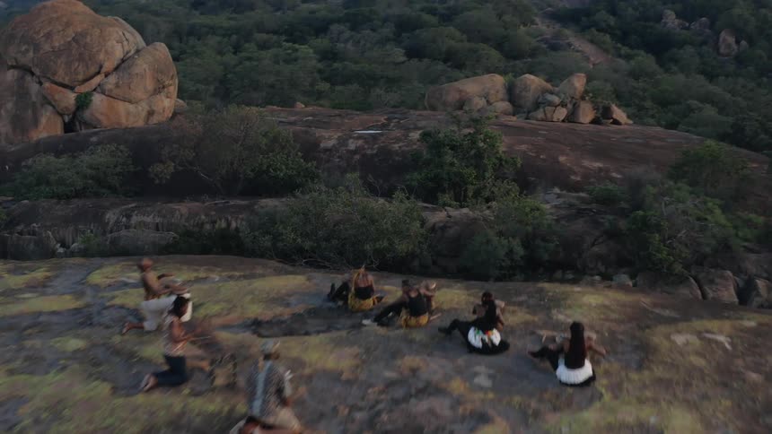 Musician play on plateau on mountain surrounded by forest