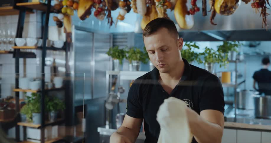 Two workers are working at a restaurant together