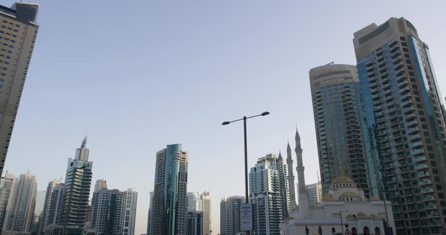 Mirrored skyscrapers loom over downtown