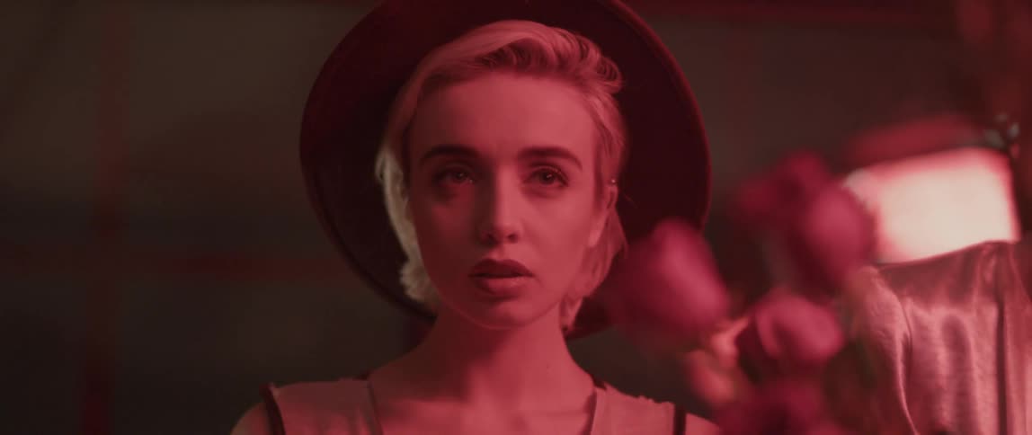 A young woman stares while looking disinterested