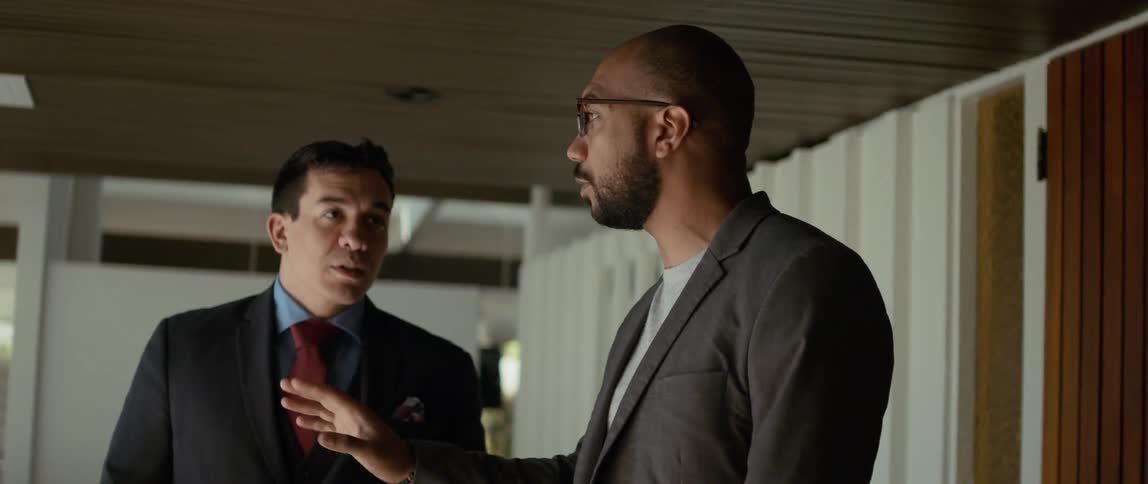 Two men talk in the room