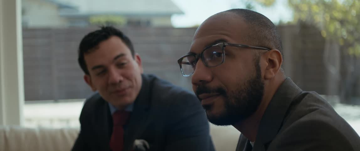 A real estate agent talks to a bored customer