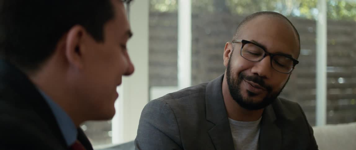 Two men sitting around talking