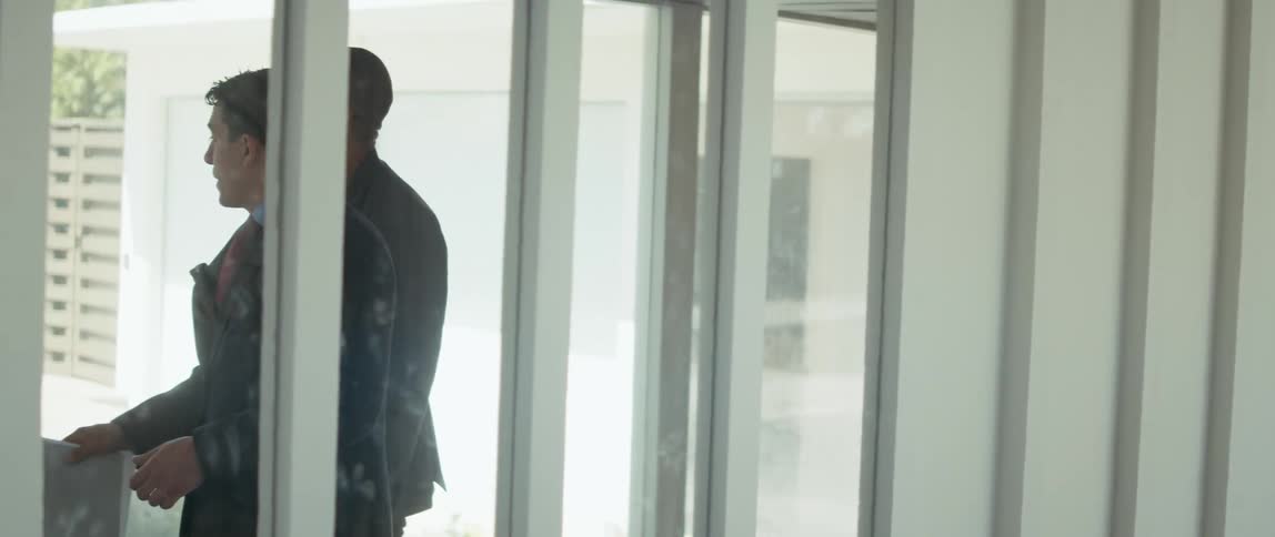 The real estate agent is showing a man the home