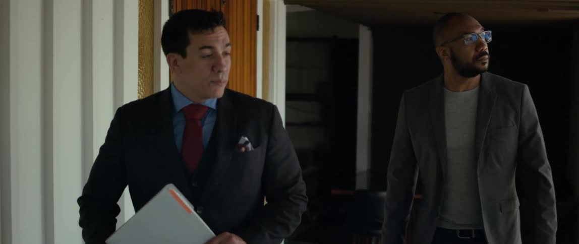 Two coworkers walking and talking together