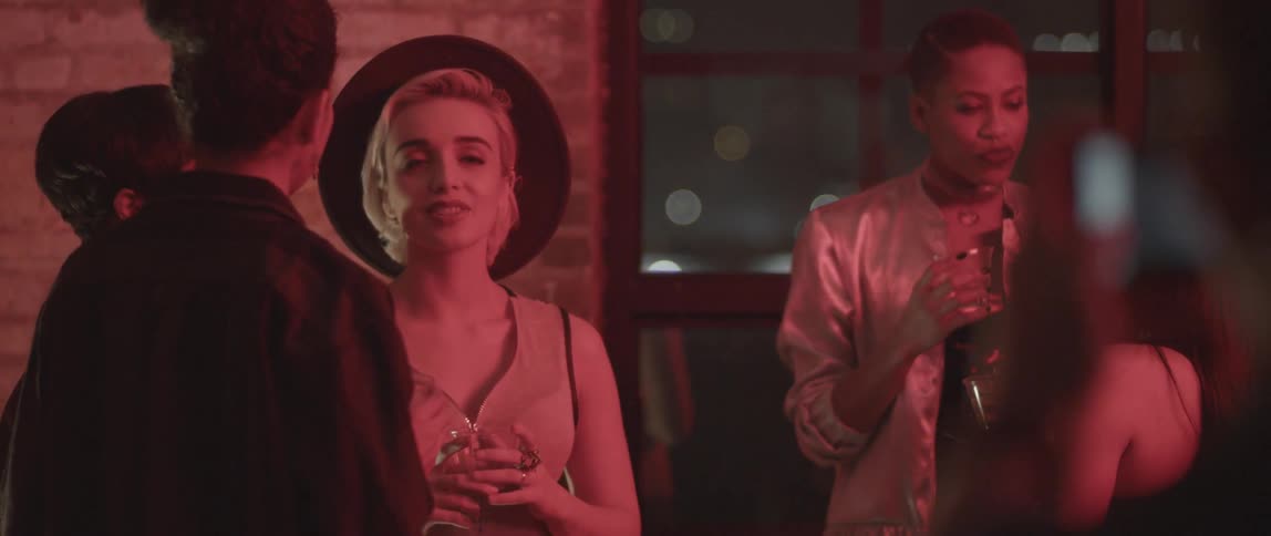 People talk with drinks in their hands