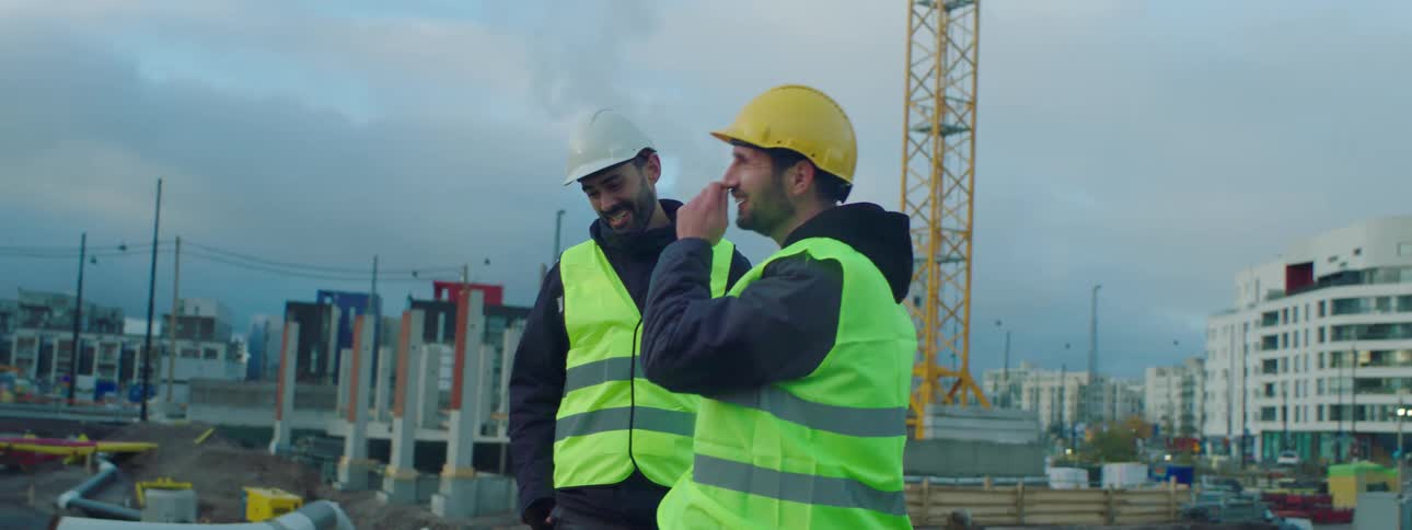 Two construction workers outdoors