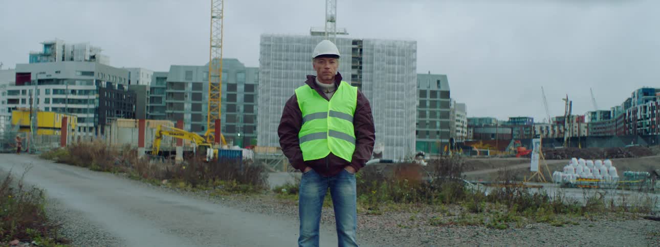 A construction worker stands on the site