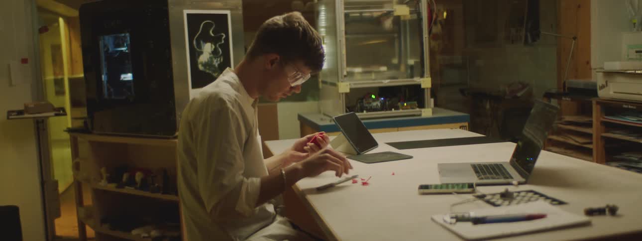 A man is cutting plastic
