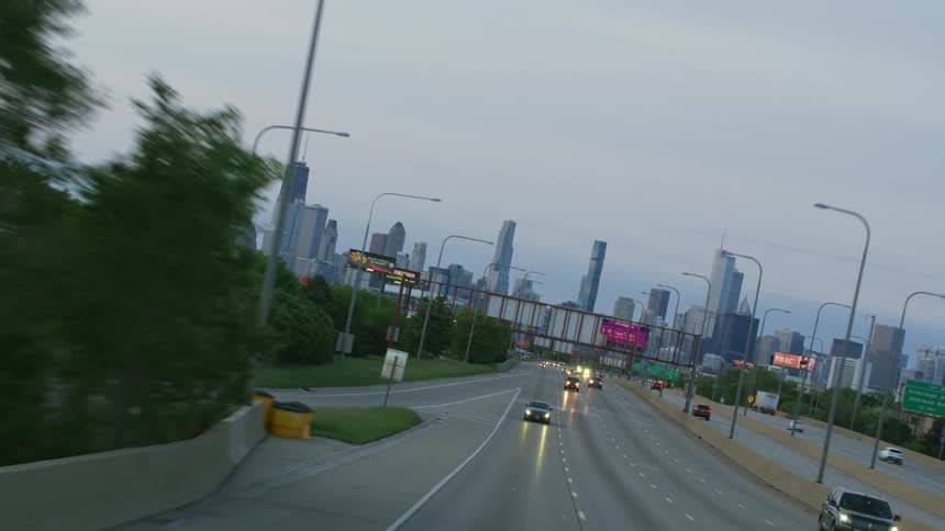 Traffic travels away from downtown Chicago on a cloudy evening