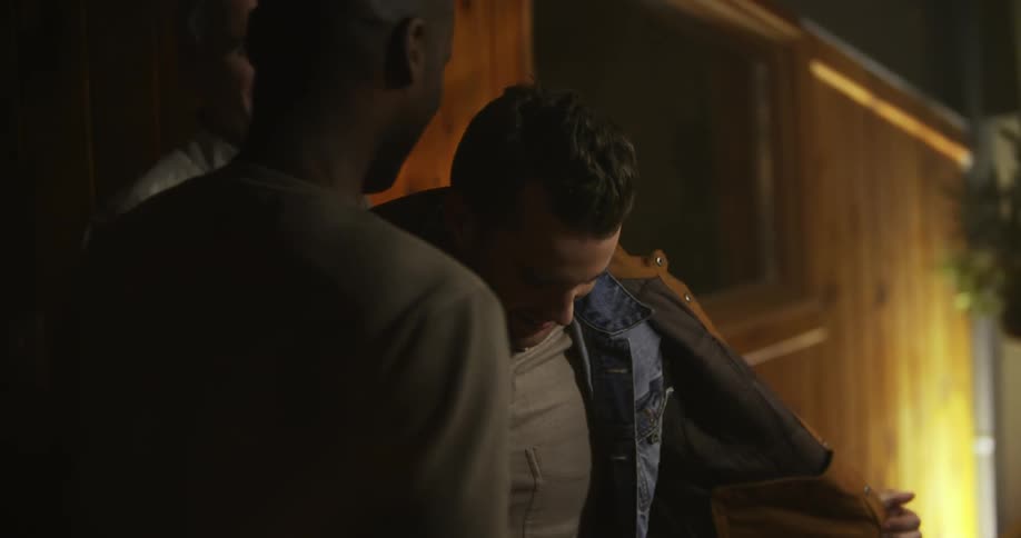 Two men greeting each other with a hug
