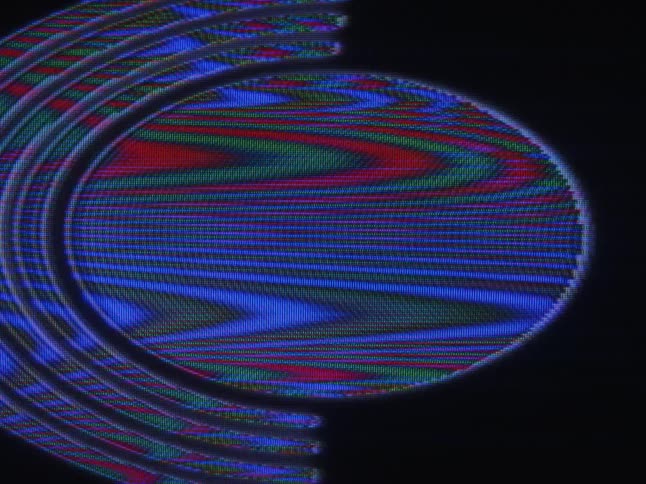 A digital display of colorful shapes lines and waves on black