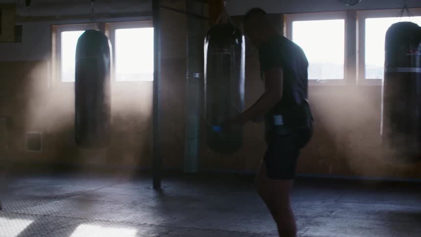 A man jumps rope as he exercises