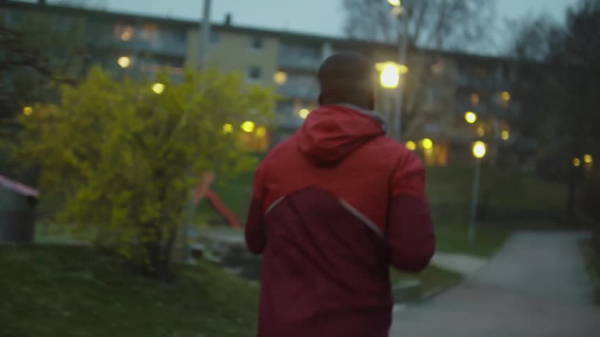 A man is jogging in the park