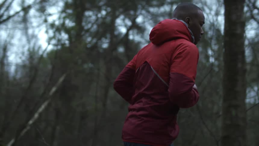 A man running in the woods