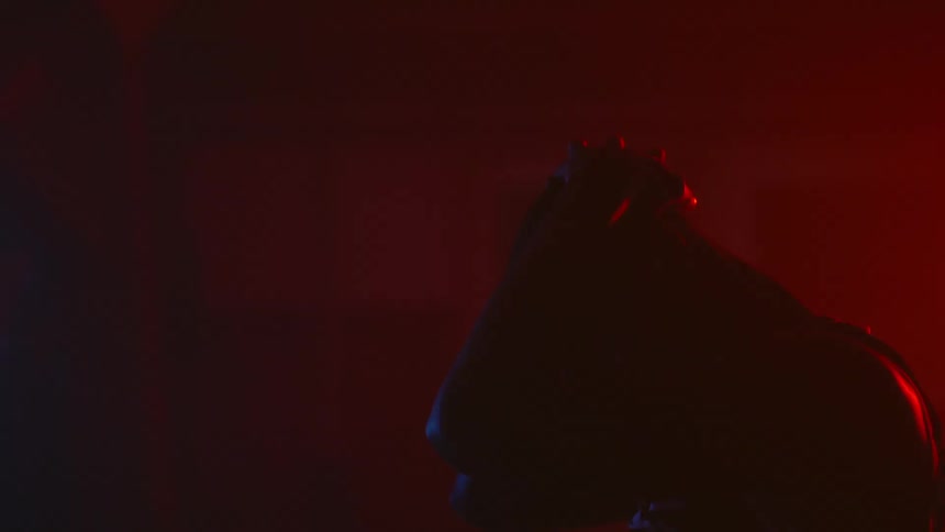 A man is sweating in the dark room