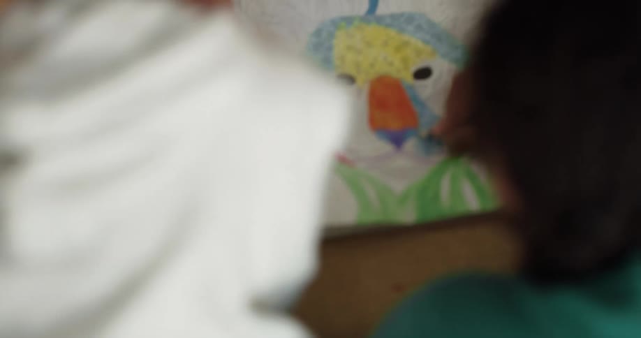 Two children are coloring