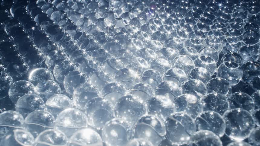 A close up of balls losing water