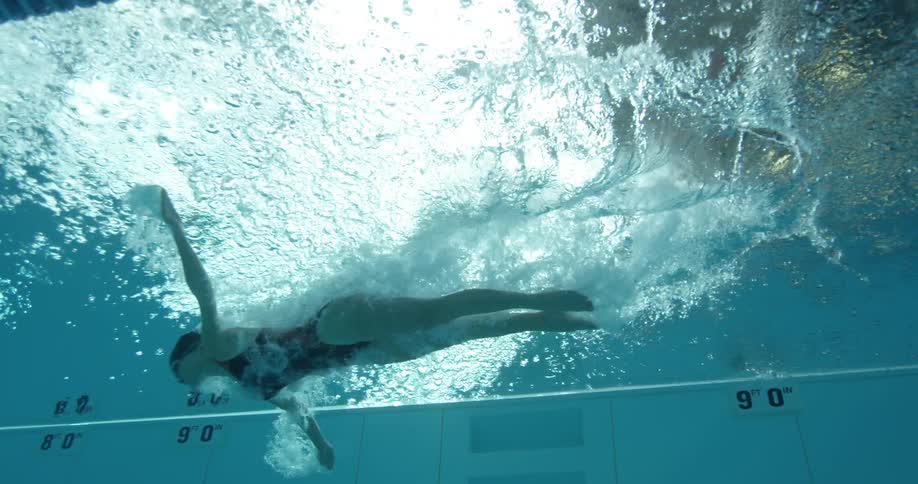 A woman swims in a pool