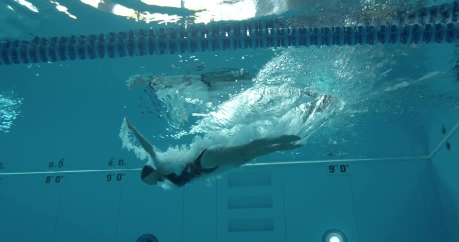 A woman diving into a pool