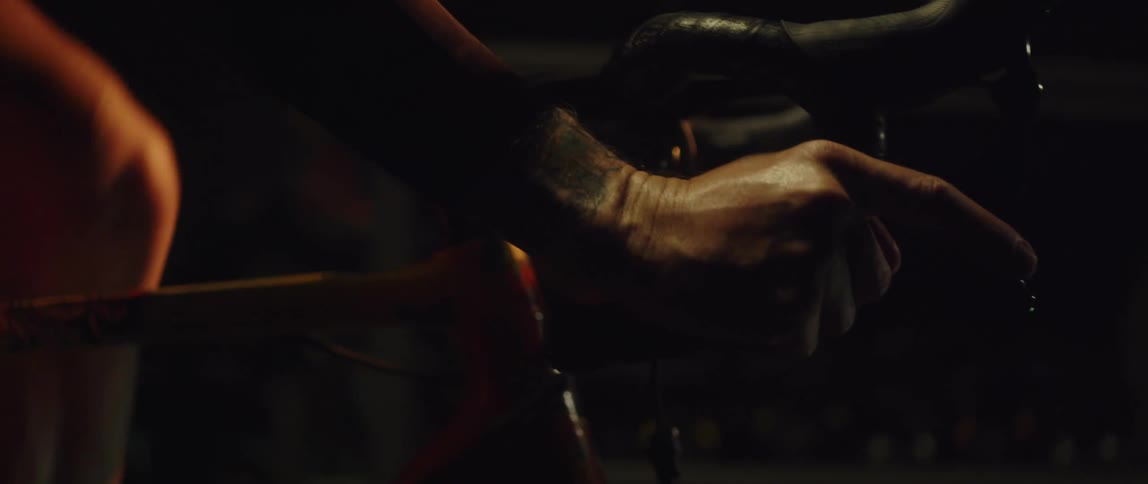 A person is riding a bike indoors