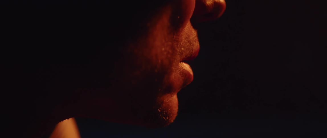 Close up of male cylists face with glasses in red light