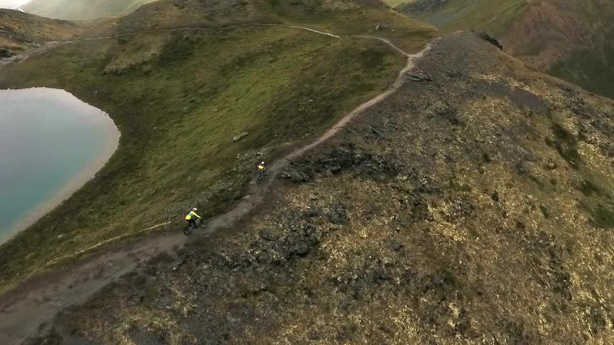 People biking along a dirt path