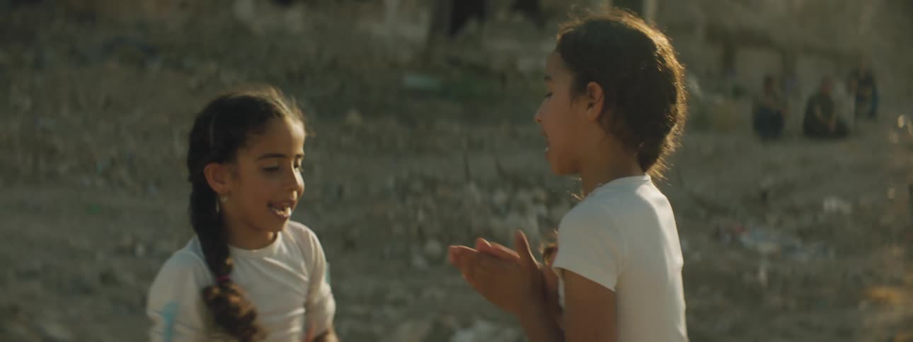 Two little girls playing in a village